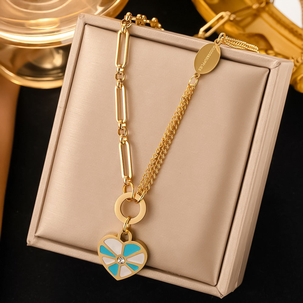 Geometric enamel heart necklace and earring set.