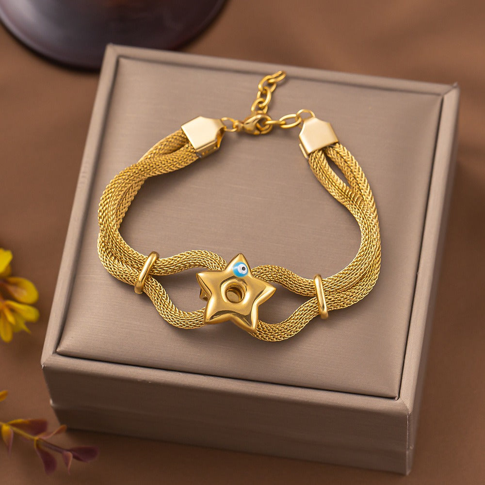 bracelet with a central star and Turkish eye charm.