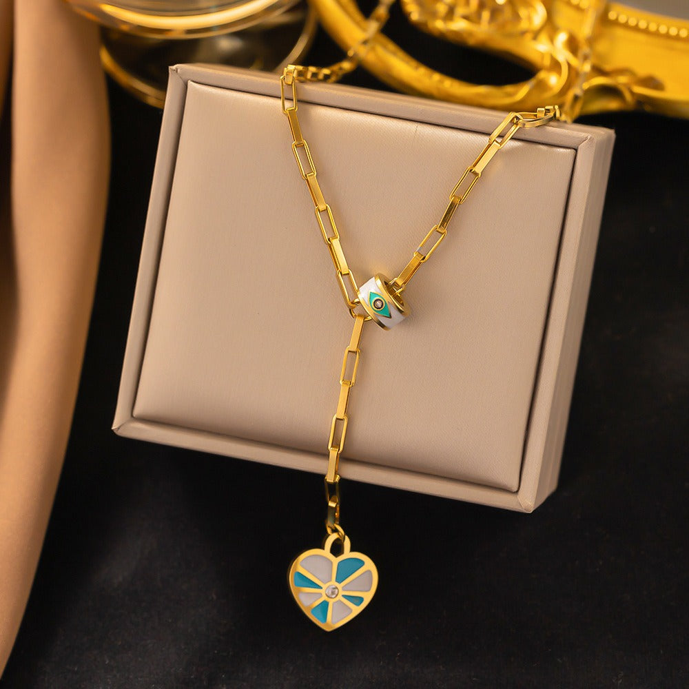 Geometric enamel heart necklace and earring set.